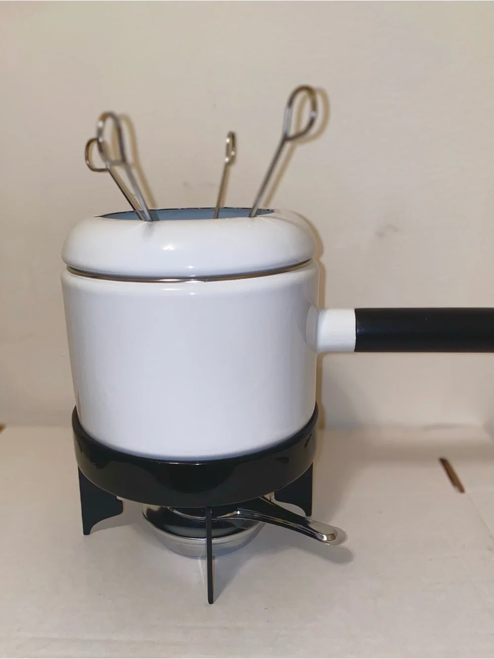 White Metal Fondue Pot/Black Handle - 4 Silver Forks. Black Stand. Fuel Holder.